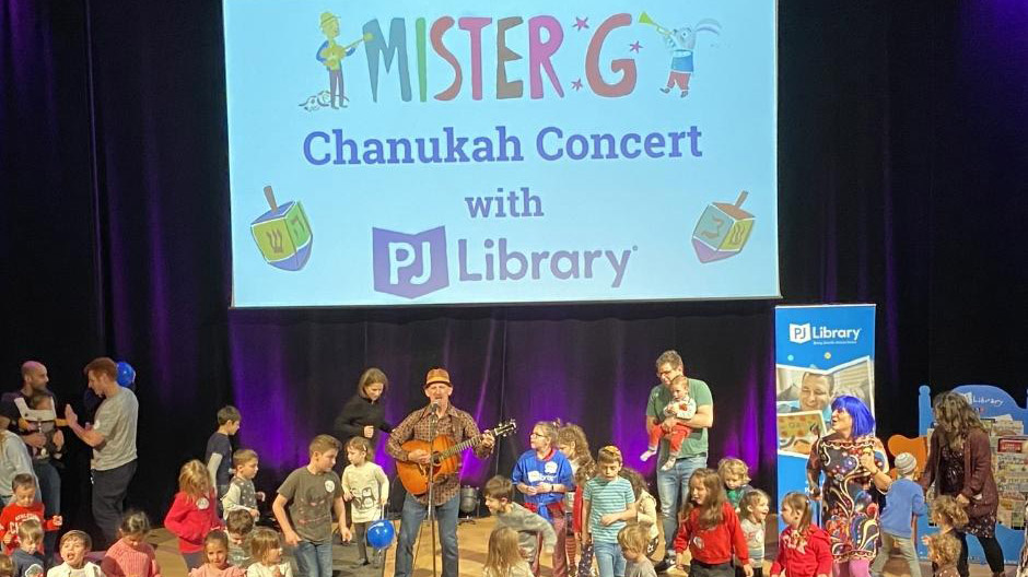 Mister G in Concert with children playing and dancing