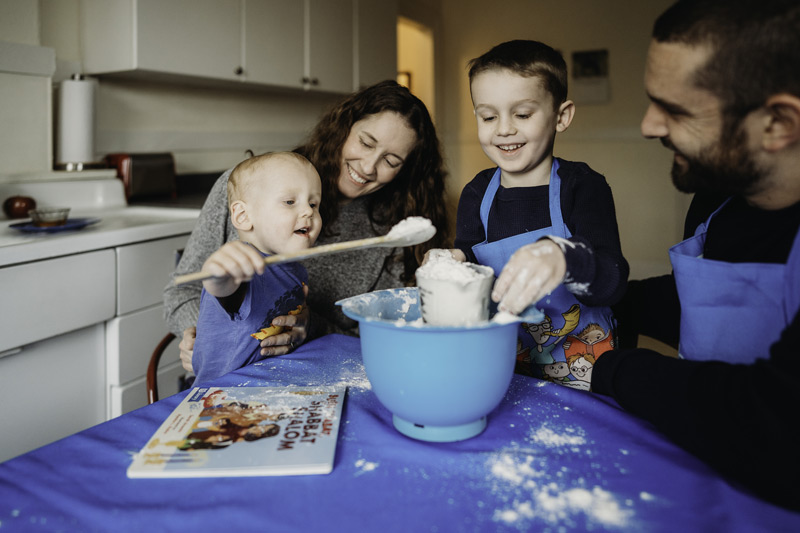 A family measuring flour