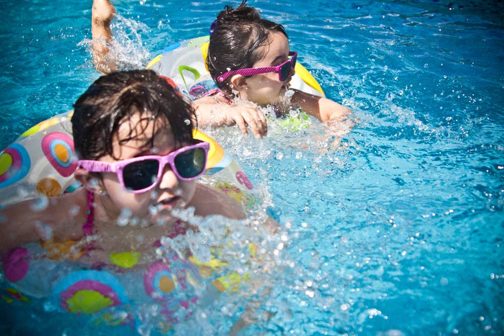 children playing in a pool