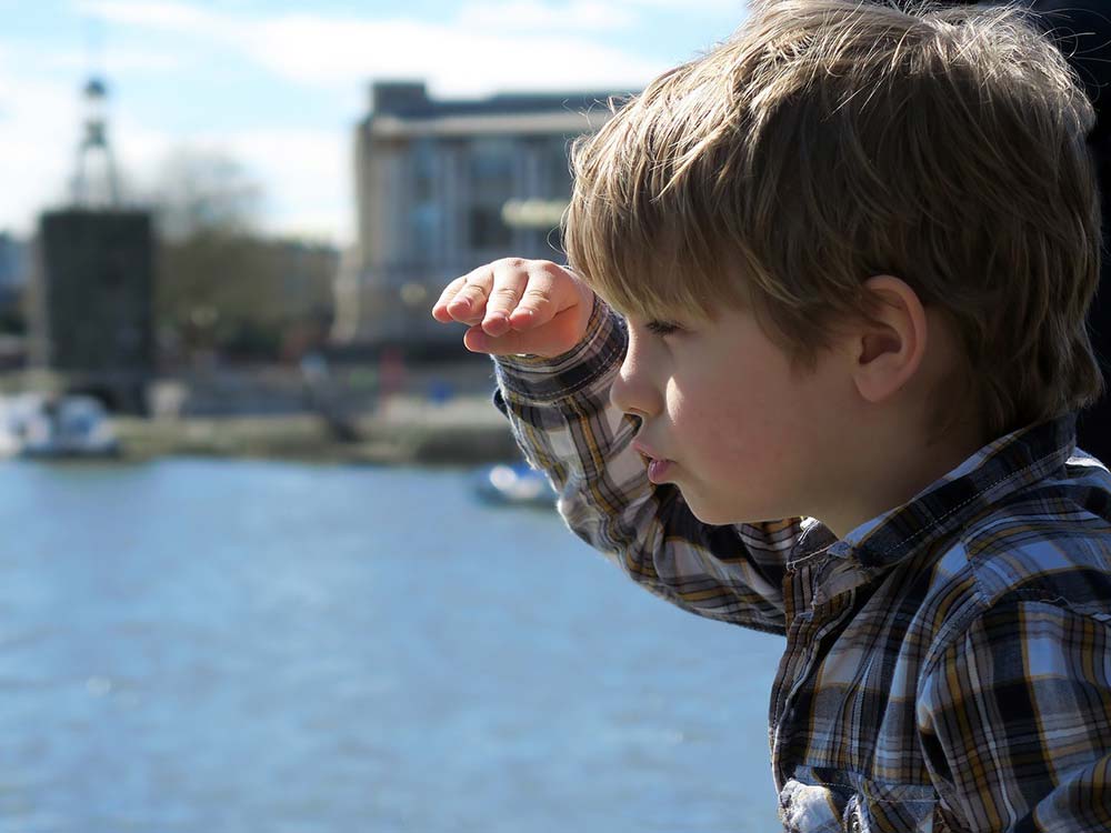 boy looking out over water