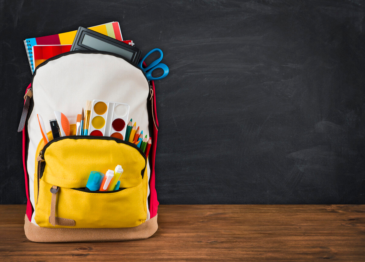 Child's backpack full of school supplies