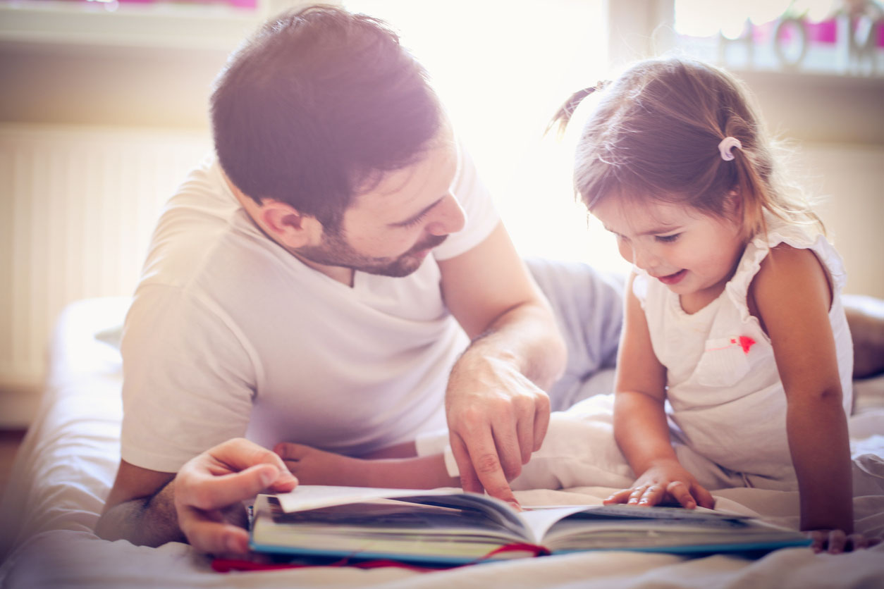 Dad and Daughter Reading a Book