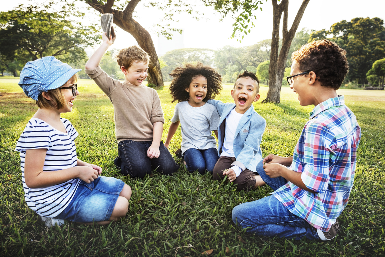 Children Sitting in Grass