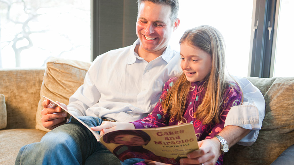 Father and Daughter Reading Together